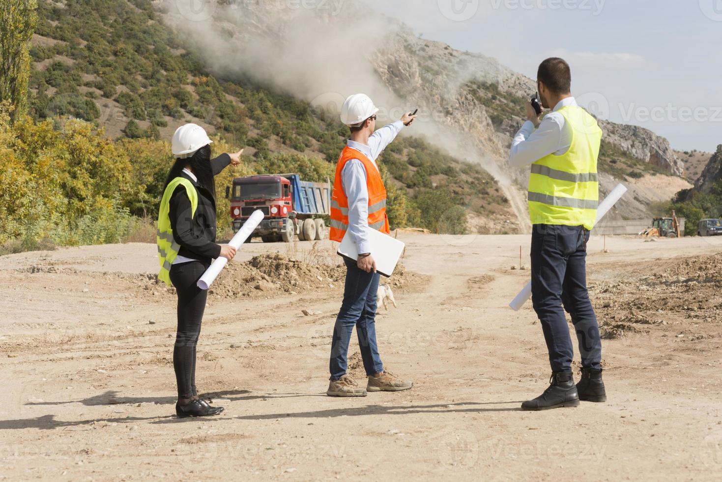 construction workers controlling explosion photo