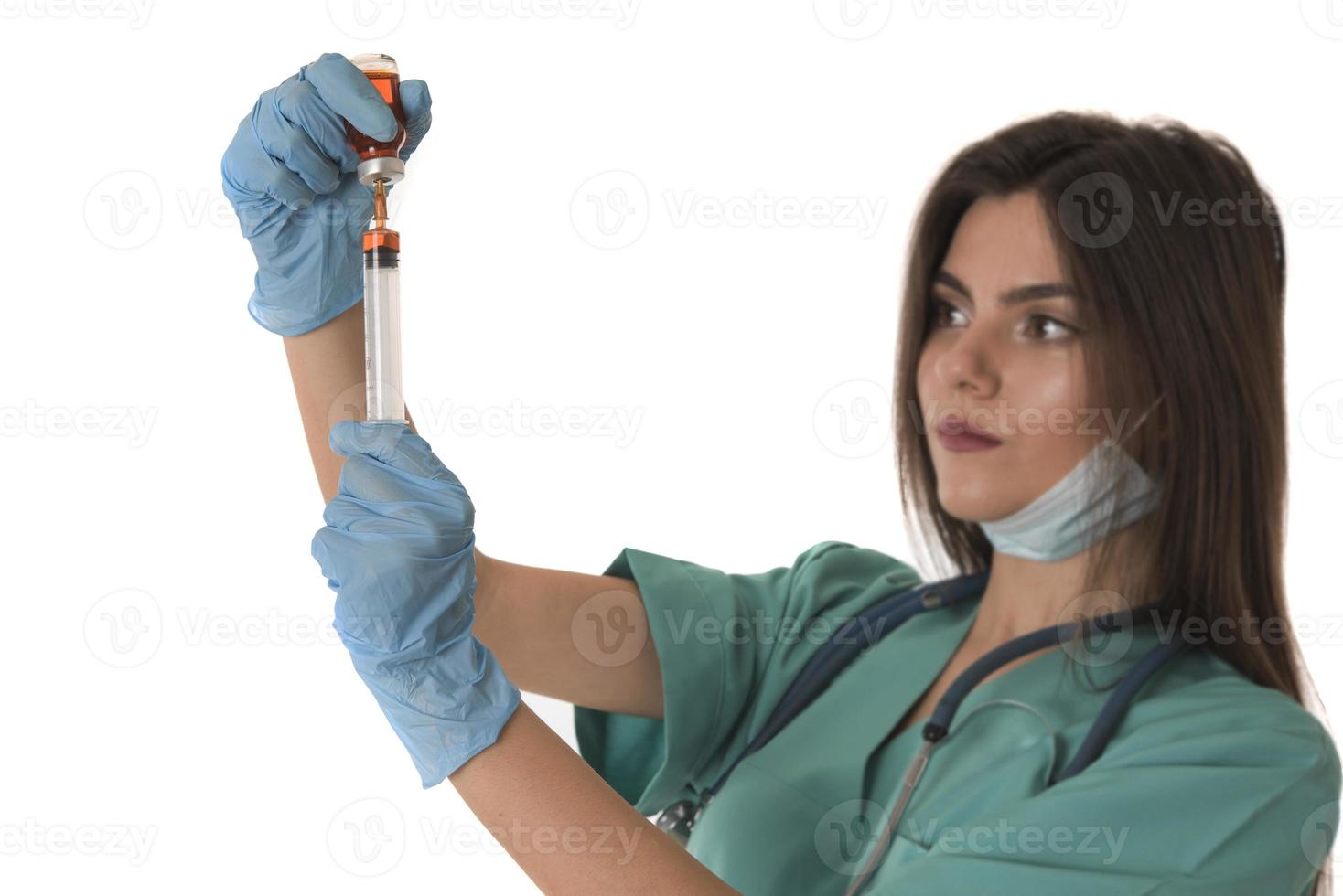 Woman Nurse with protective workwear holding Vaccine and syringe photo