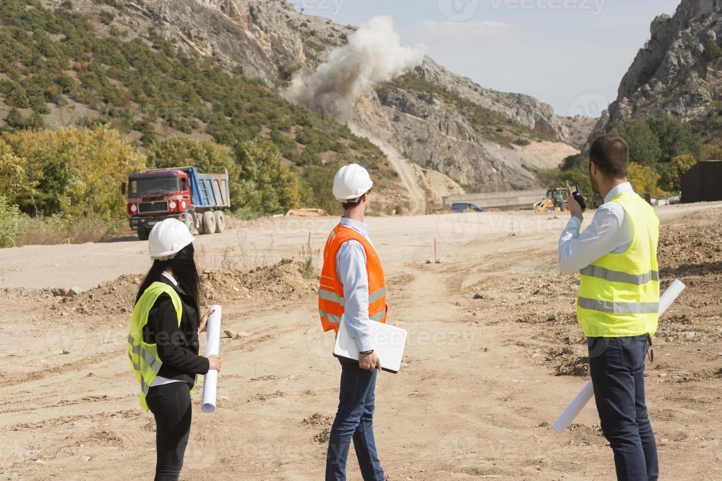 construction workers controlling explosion photo