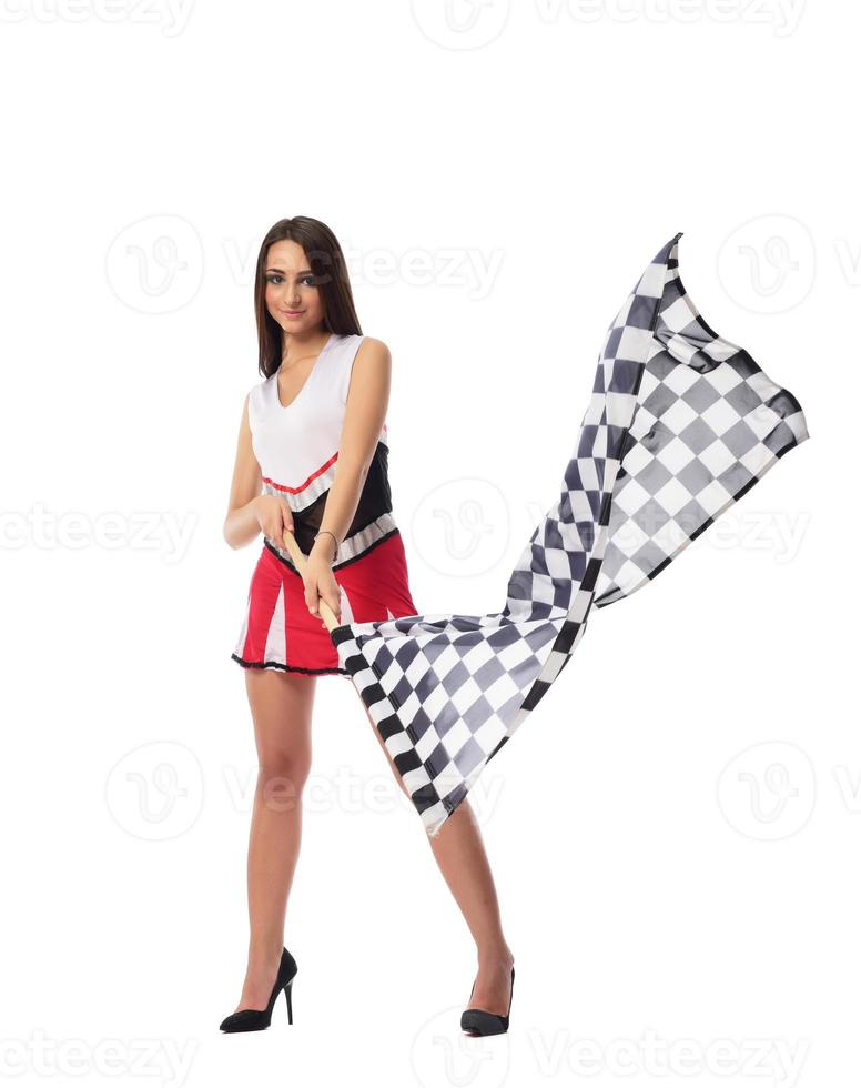 beautiful model holding finish flag isolated on white background. motorsport finish flag in hands female model. photo