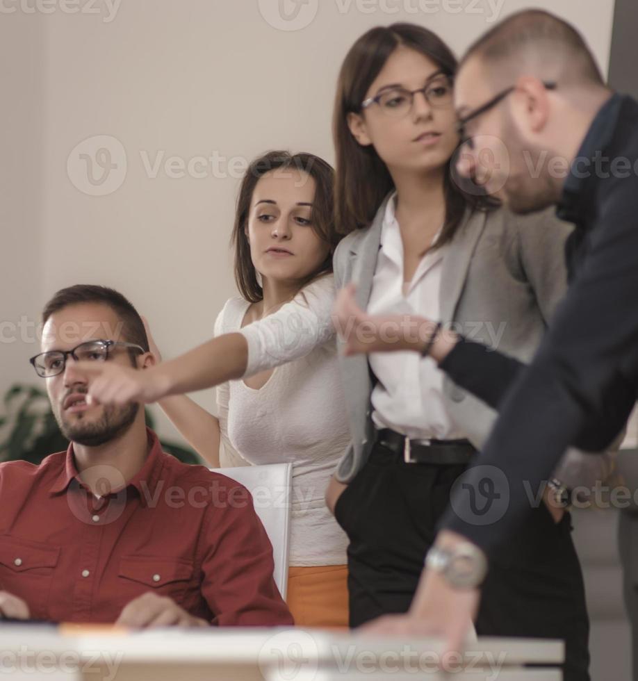 Group of designers programmers working on a new project at the office. photo
