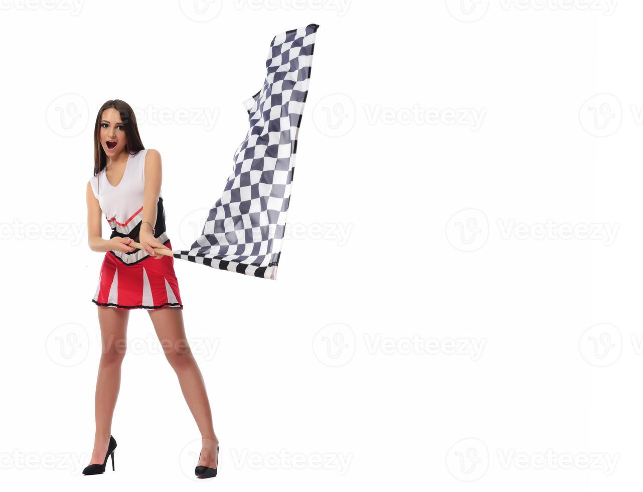 beautiful model holding finish flag isolated on white background. motorsport finish flag in hands female model. photo