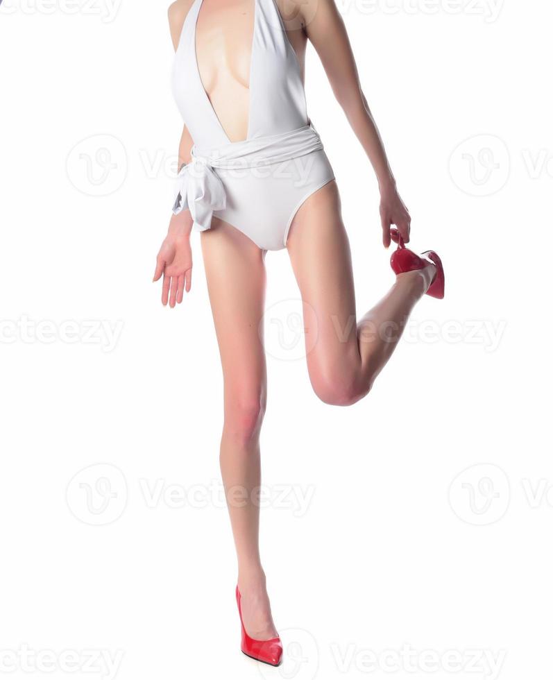 beautiful woman's legs in high hills, isolated on white background photo