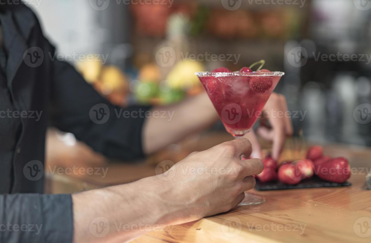 Cold cocktail with lime, lemon, tonic, vodka and ice photo