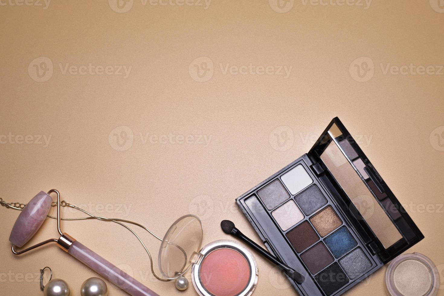 Beauty background with facial cosmetic, make-up products and jewelry, with free space for text. photo