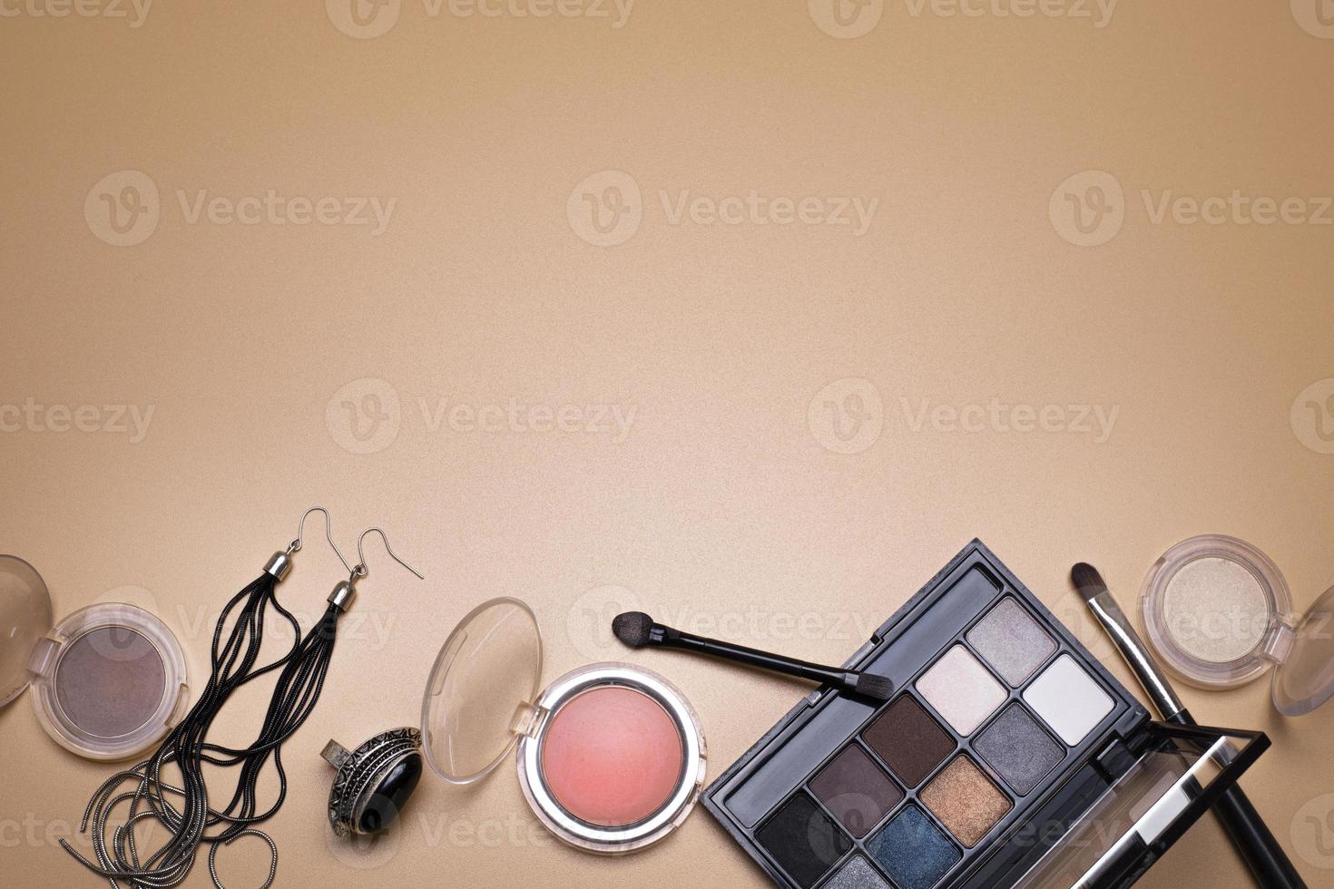 Beauty background with facial cosmetic, make-up products and jewelry, with free space for text. photo