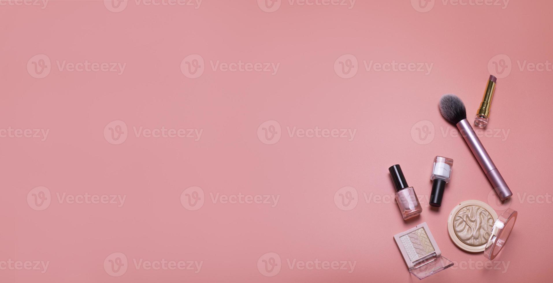 Pink beauty background with facial cosmetic, make-up products. Free space for text, copy space. Modern layout, top view, flat lay. Make up, skin care, beauty concept. photo