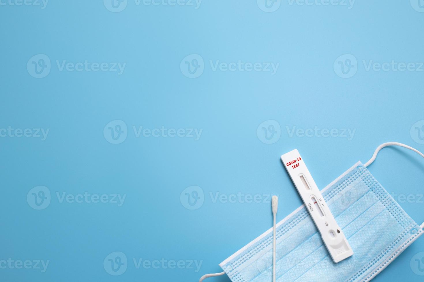 Rapid Coronavirus test on the blue background. Negative test result by using rapid test device for COVID-19. Free space for text. photo