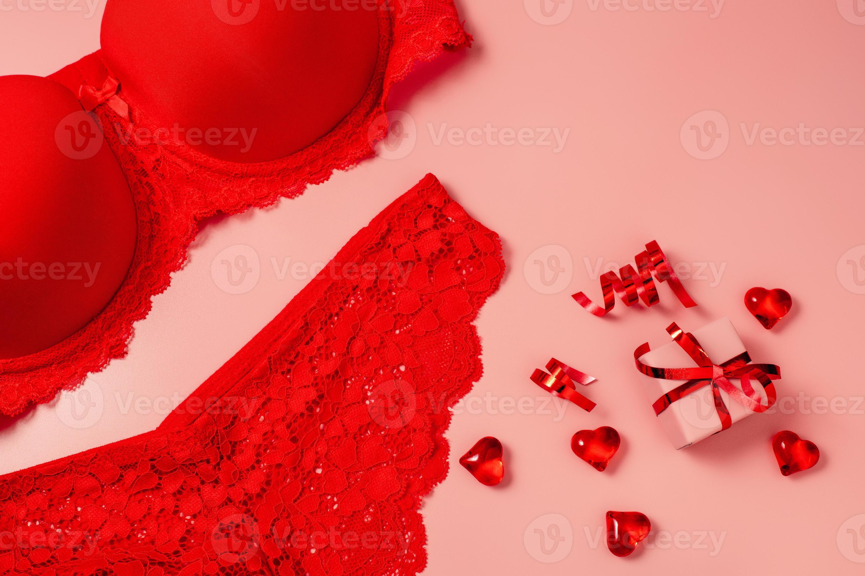 Pink Valentine's Day background with beautiful female lacy panties, bra,  hearts and gift box. Sexy underwear. Free space for text, copy space.  Postcard, greeting card design. Love, celebration concept 16628148 Stock  Photo