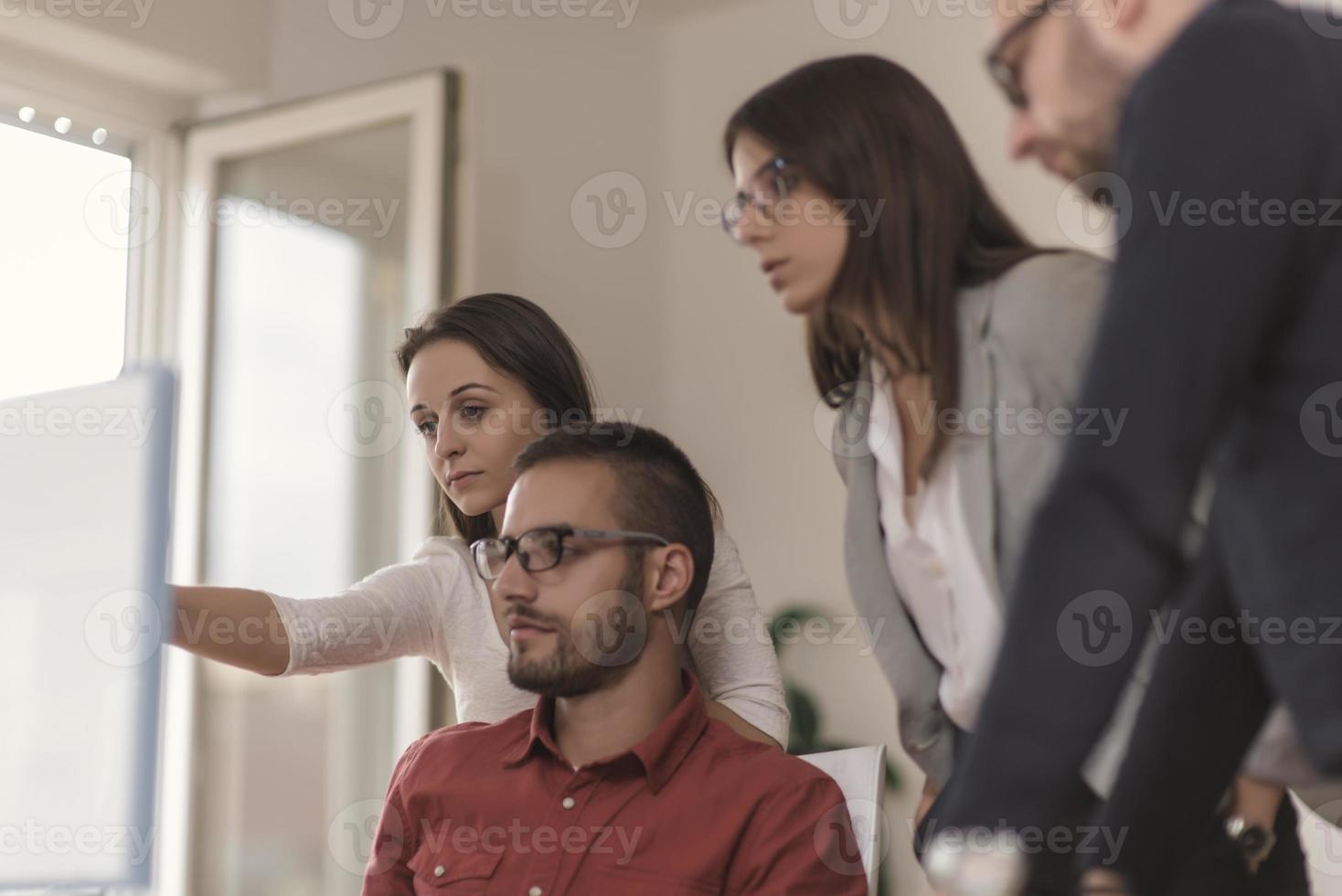 Group of designers programmers working on a new project at the office. photo