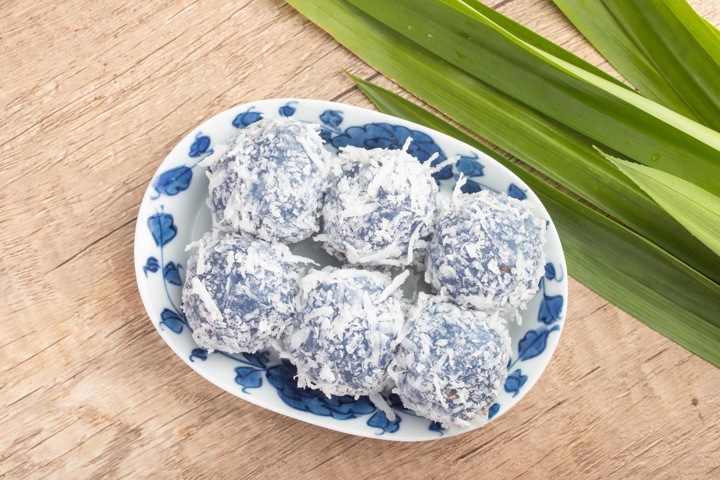 Kanom Ko or sugar dumplings in Sweet Coconut Milk mixed with coconut photo