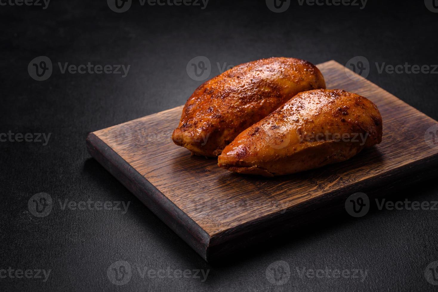 Delicious grilled chicken fillet with spices and herbs photo