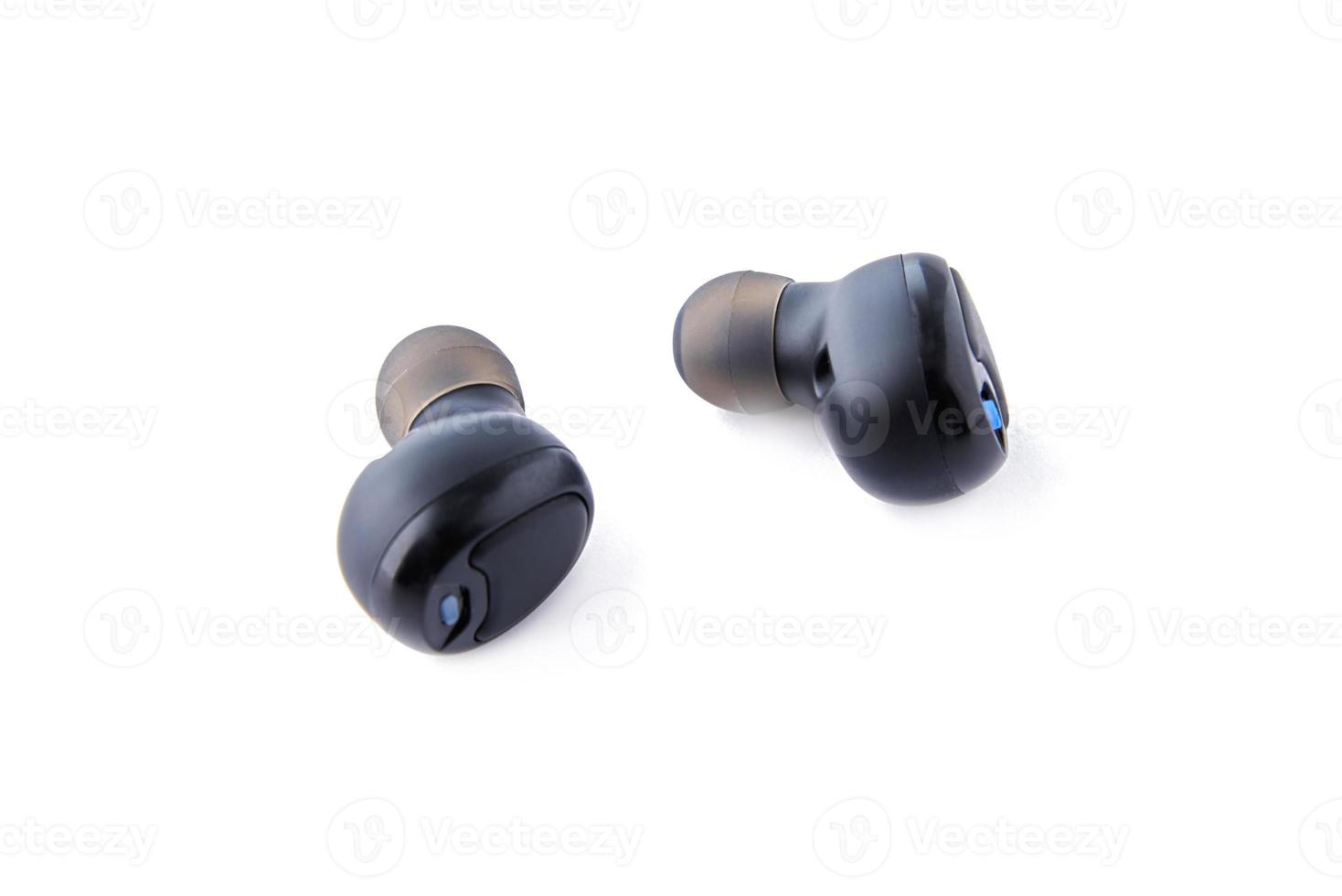 Wireless earphones isolated on white background photo