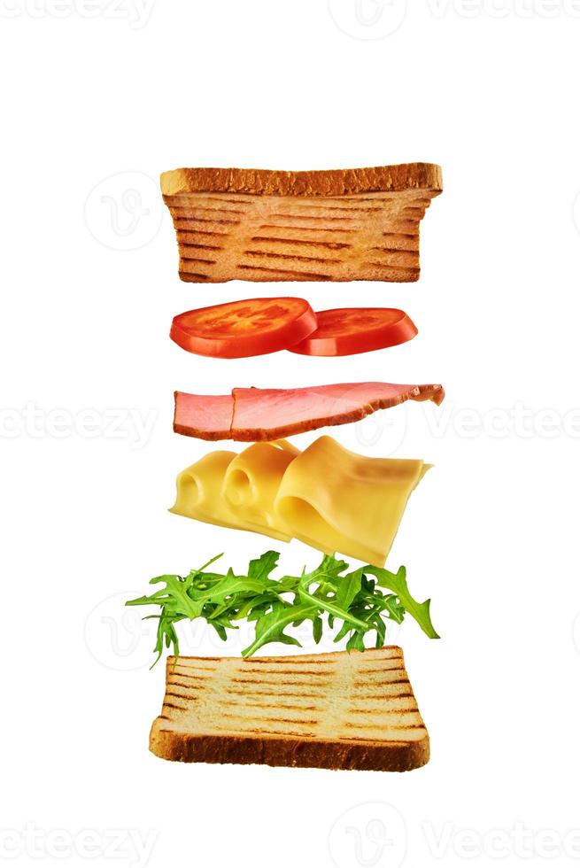 Fresh sandwich with flying ingredients on white background isolated photo