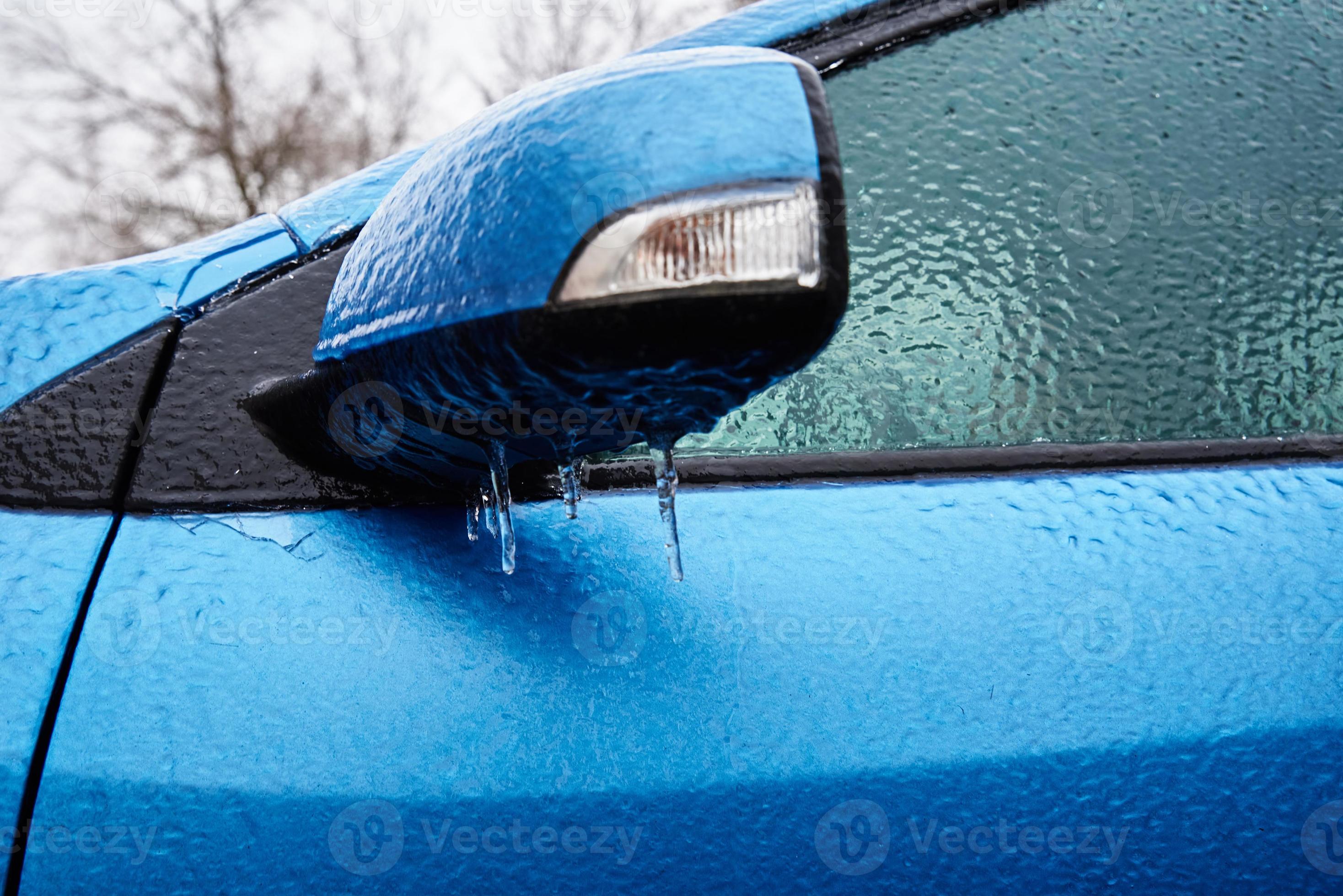 Car covered in freezing rain. Extreme winter weather for driving