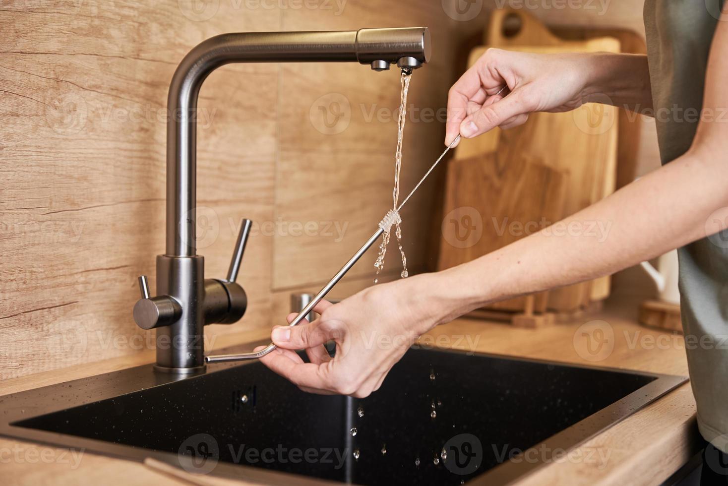 Woman clean metal straw with organic brush. Zero waste concept 16629228