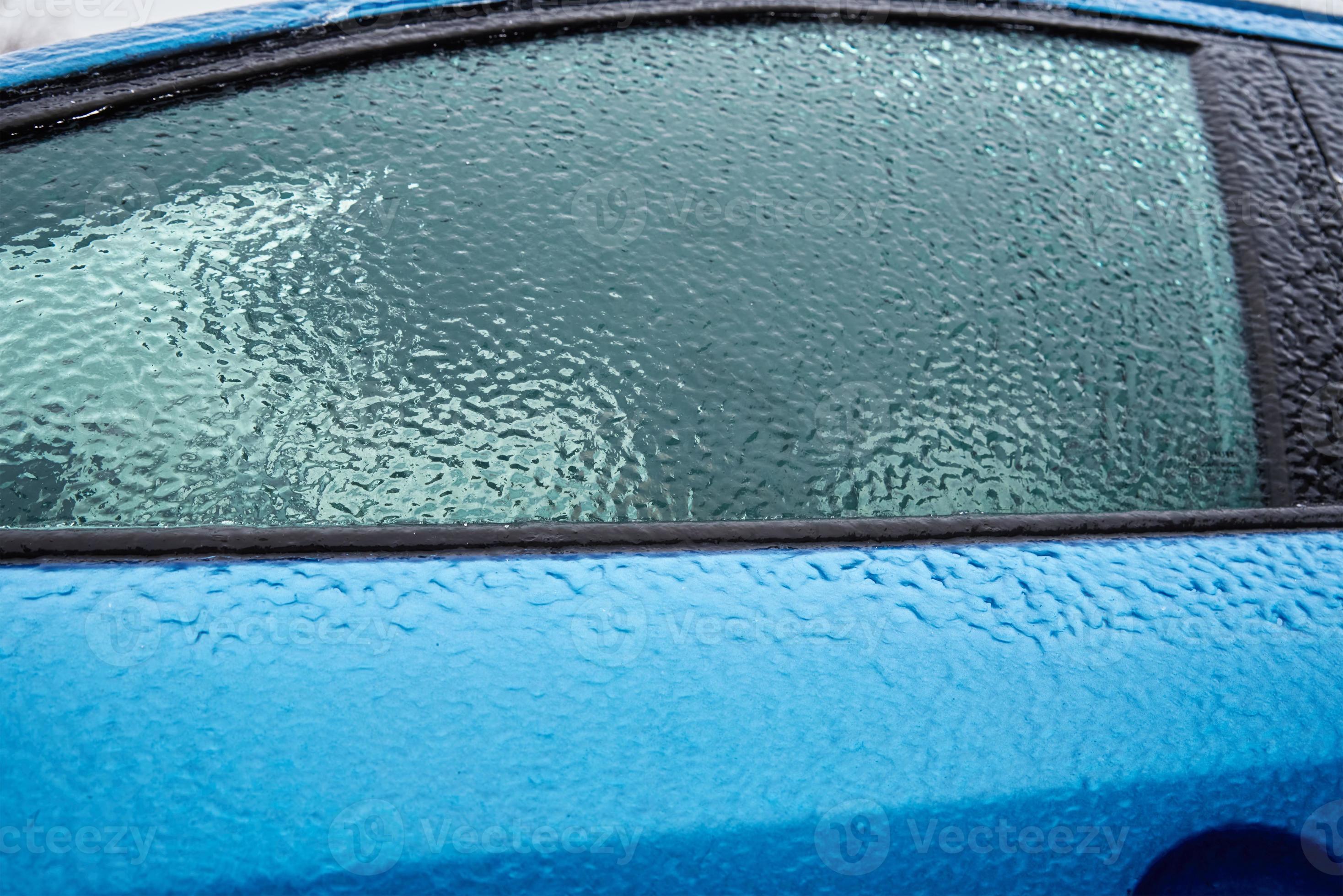 Car covered in freezing rain. Extreme winter weather for driving