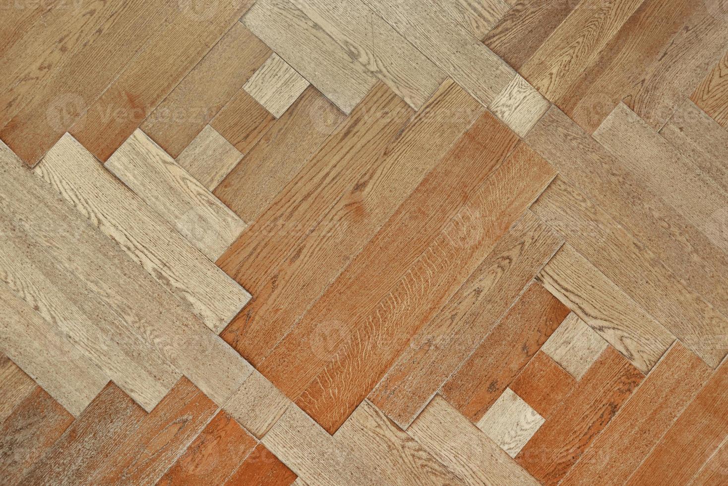 Wooden floor with pattern made of thin planks. Parquet background photo