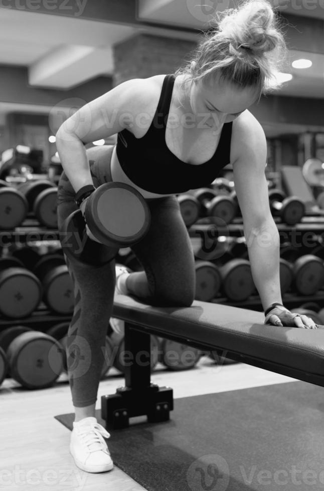 beautiful girl work out at the gym photo