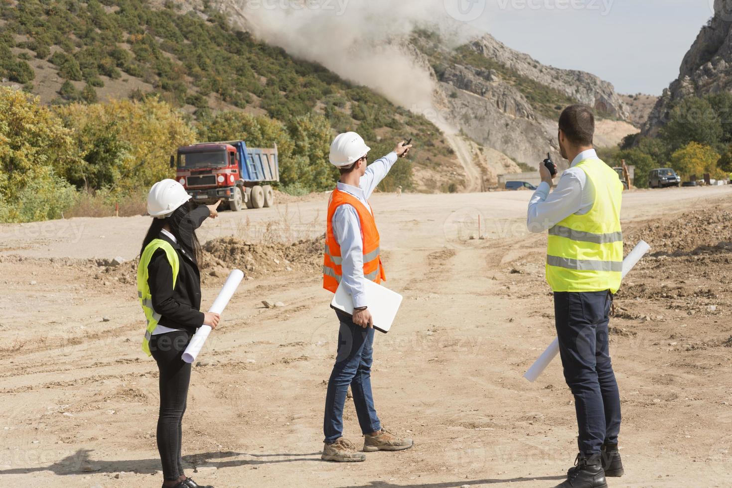 construction workers controlling explosion photo