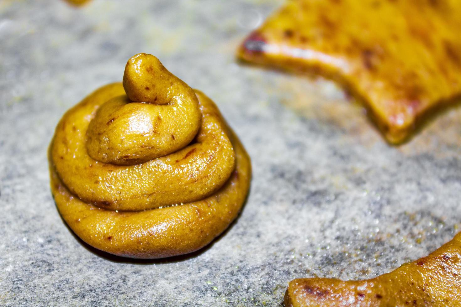 Special Christmas poop turds cookies on baking sheet. photo