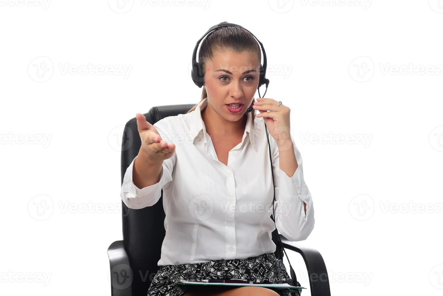 Personal assistant in the business. Hot helpline worker. Female Operator of call center with headset in white shirt photo