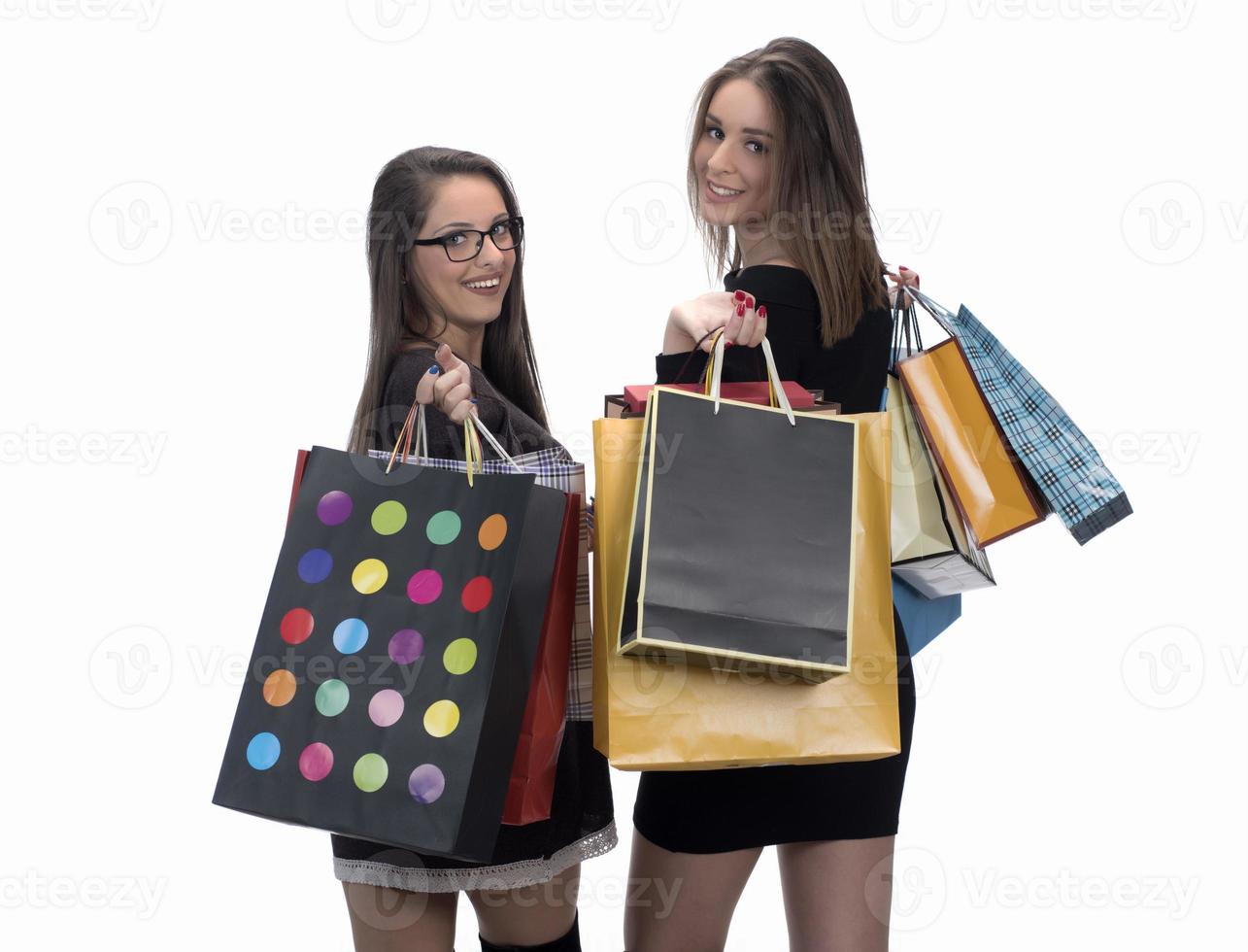 Happy friends with shopping bag on isolated studio background. photo