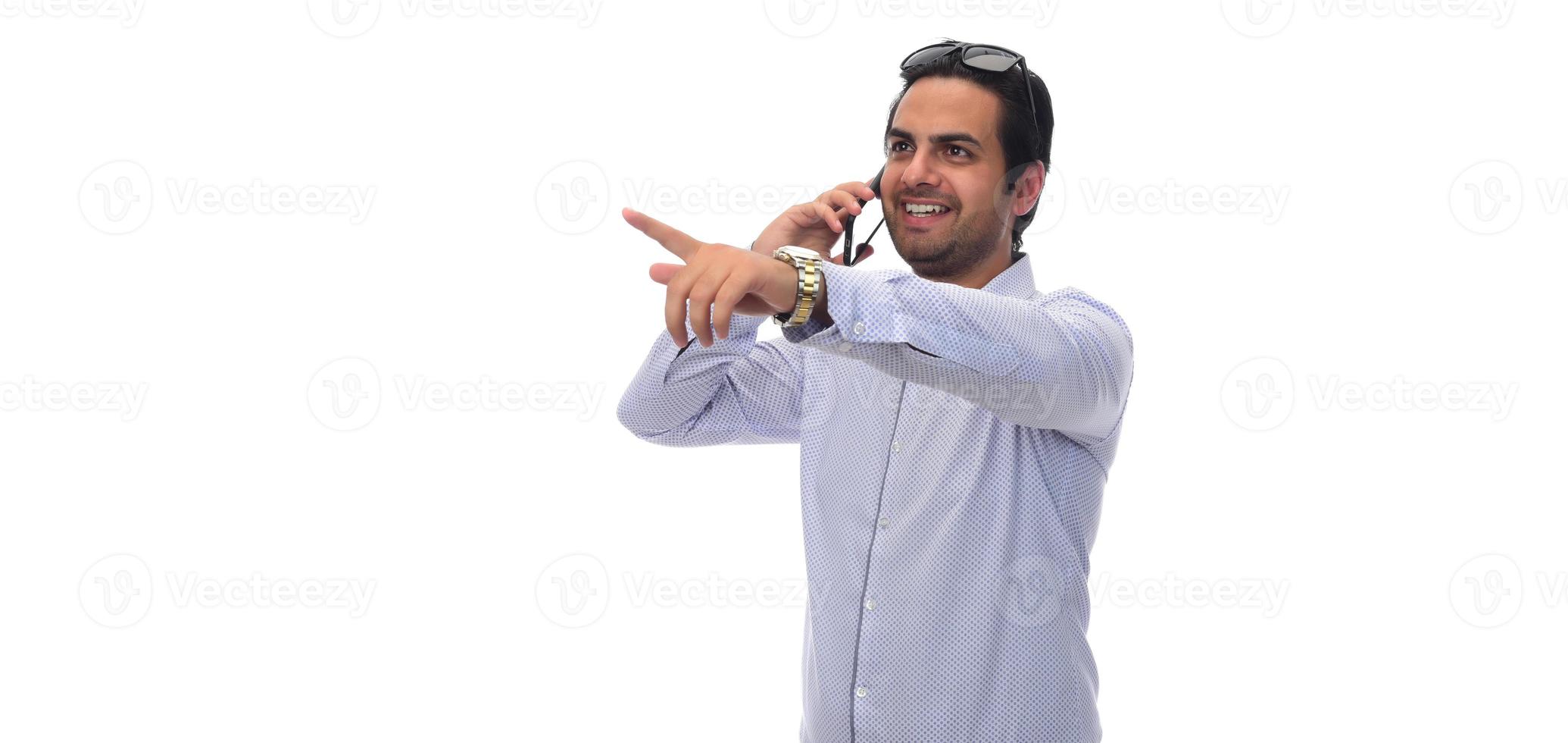 Arab businessman holding paperwork on clipboard and pointing with his finger. isolated on white photo