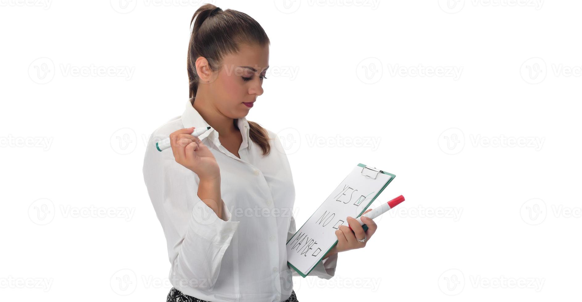 Happy young businesswoman doing business presentation at whiteboard, smiling, isolated on white background. photo