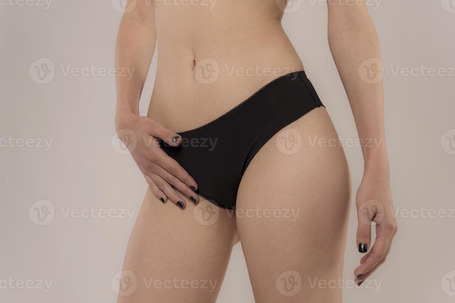 Woman with sportive slim body type in underwear photo