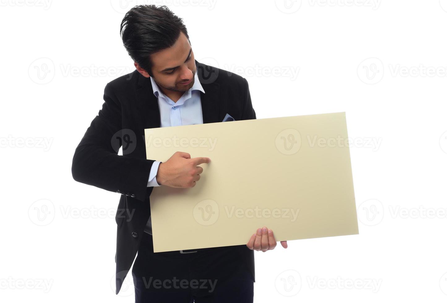 Arab businessman holding white board. advertisement concept. isolated photo