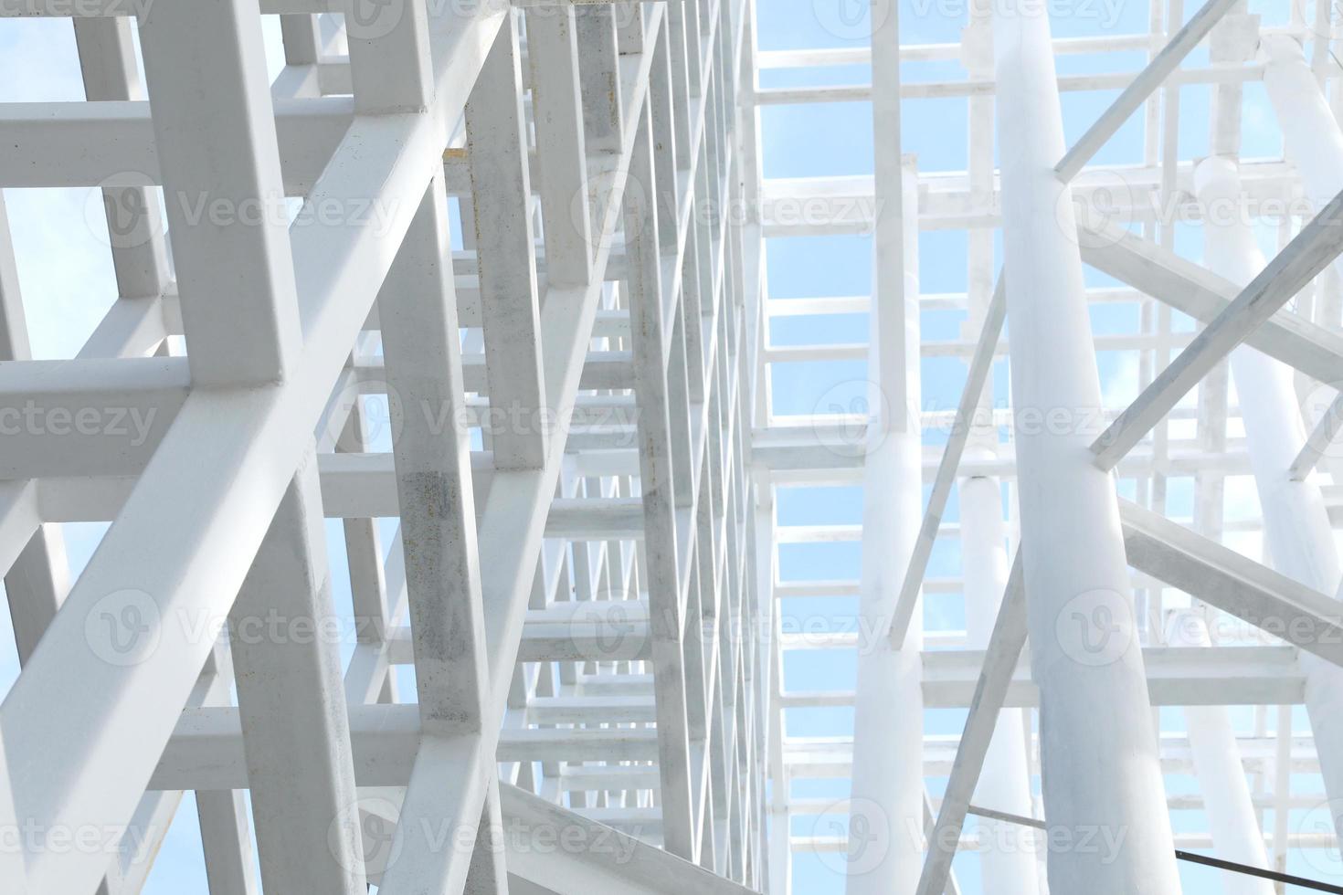 White Steel beam construction with blue sky background photo