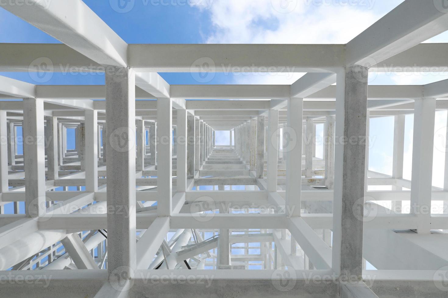 White Steel beam construction with blue sky background photo