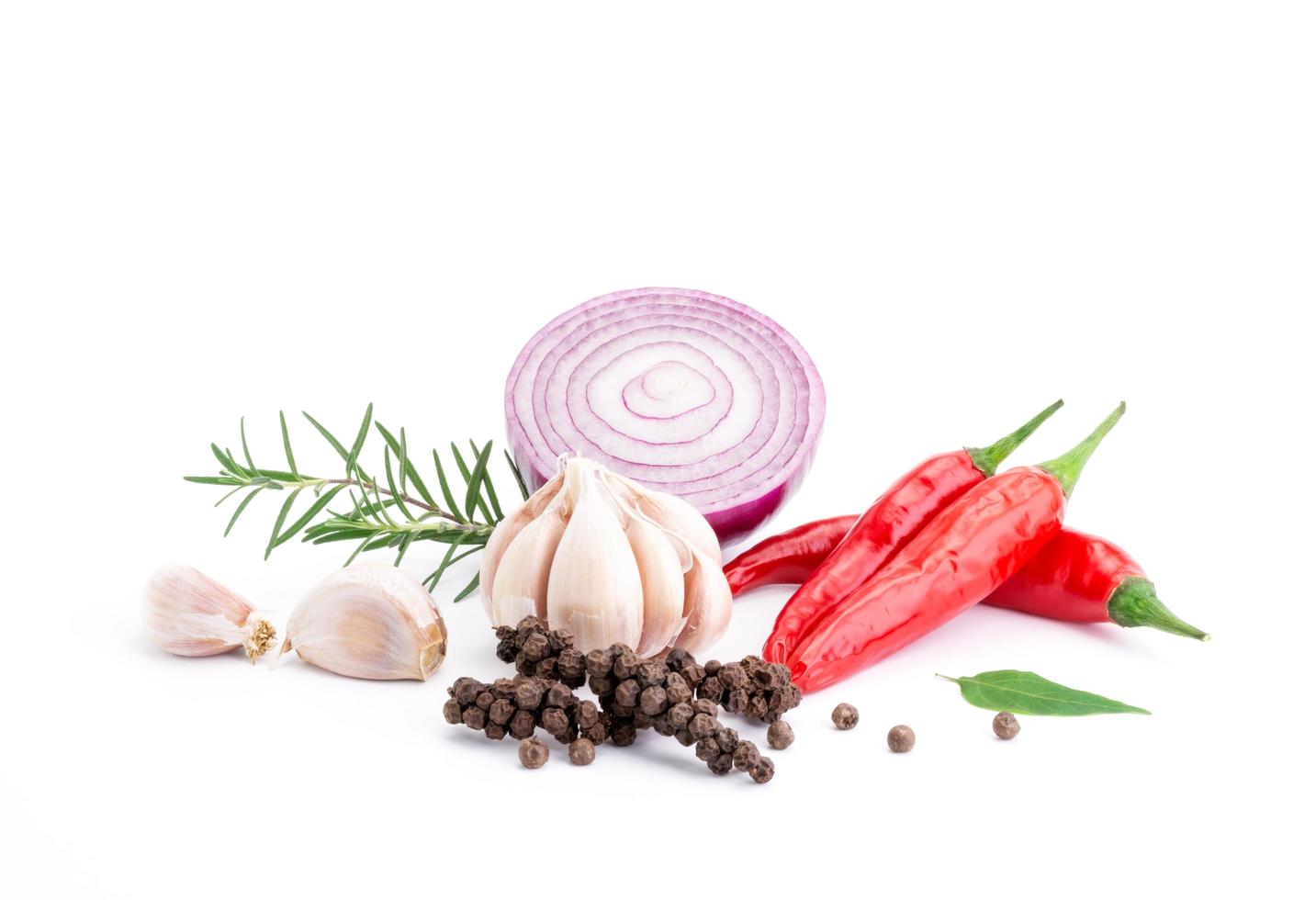 Composition of various herbs and spices vegetables rosemary pepper onion, garlic, fresh red chili, and garden mix for healthy food. isolated on white background, top view photo