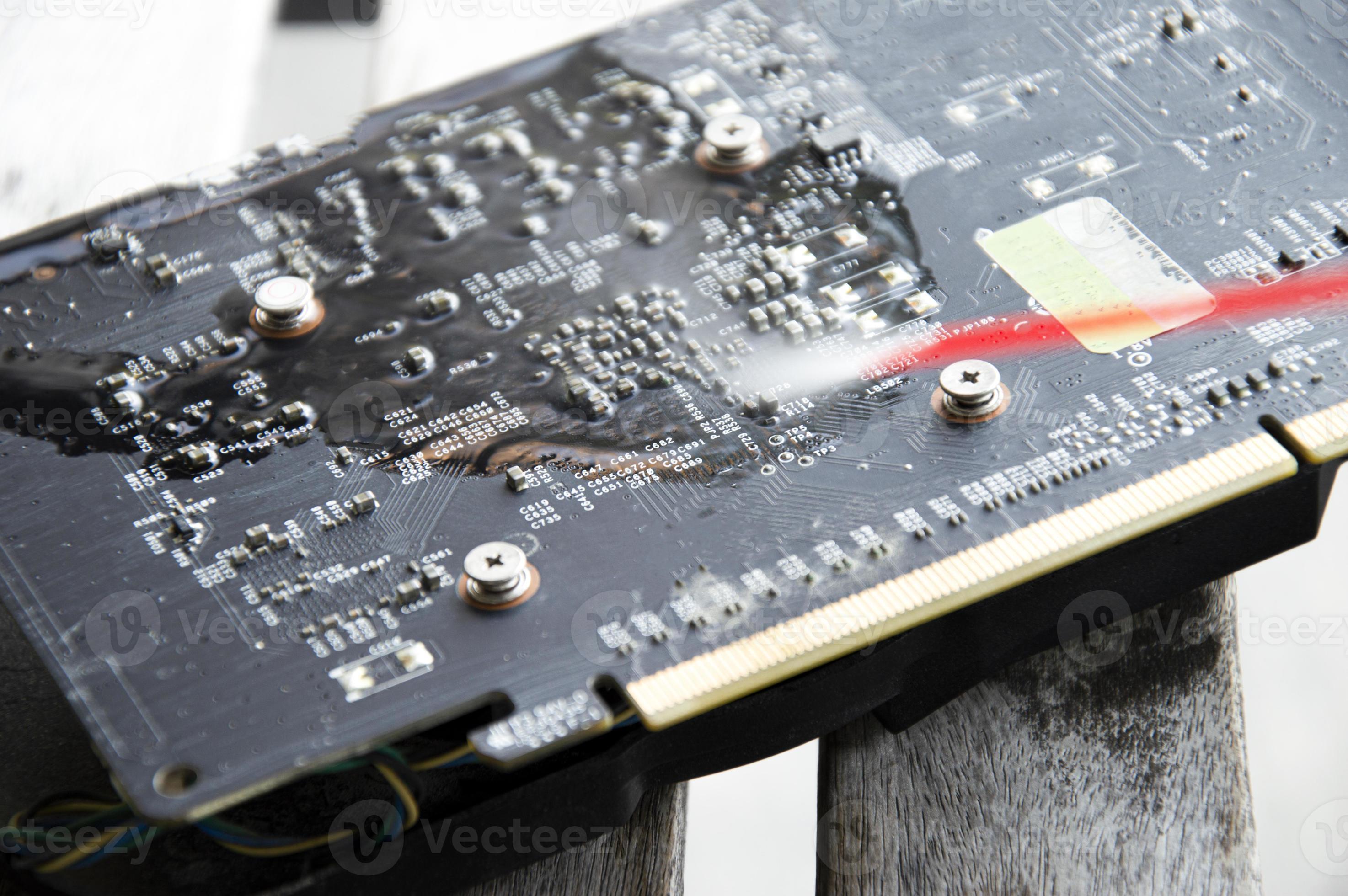 Technician view using spray to clean graphics card 16641789 Stock Photo