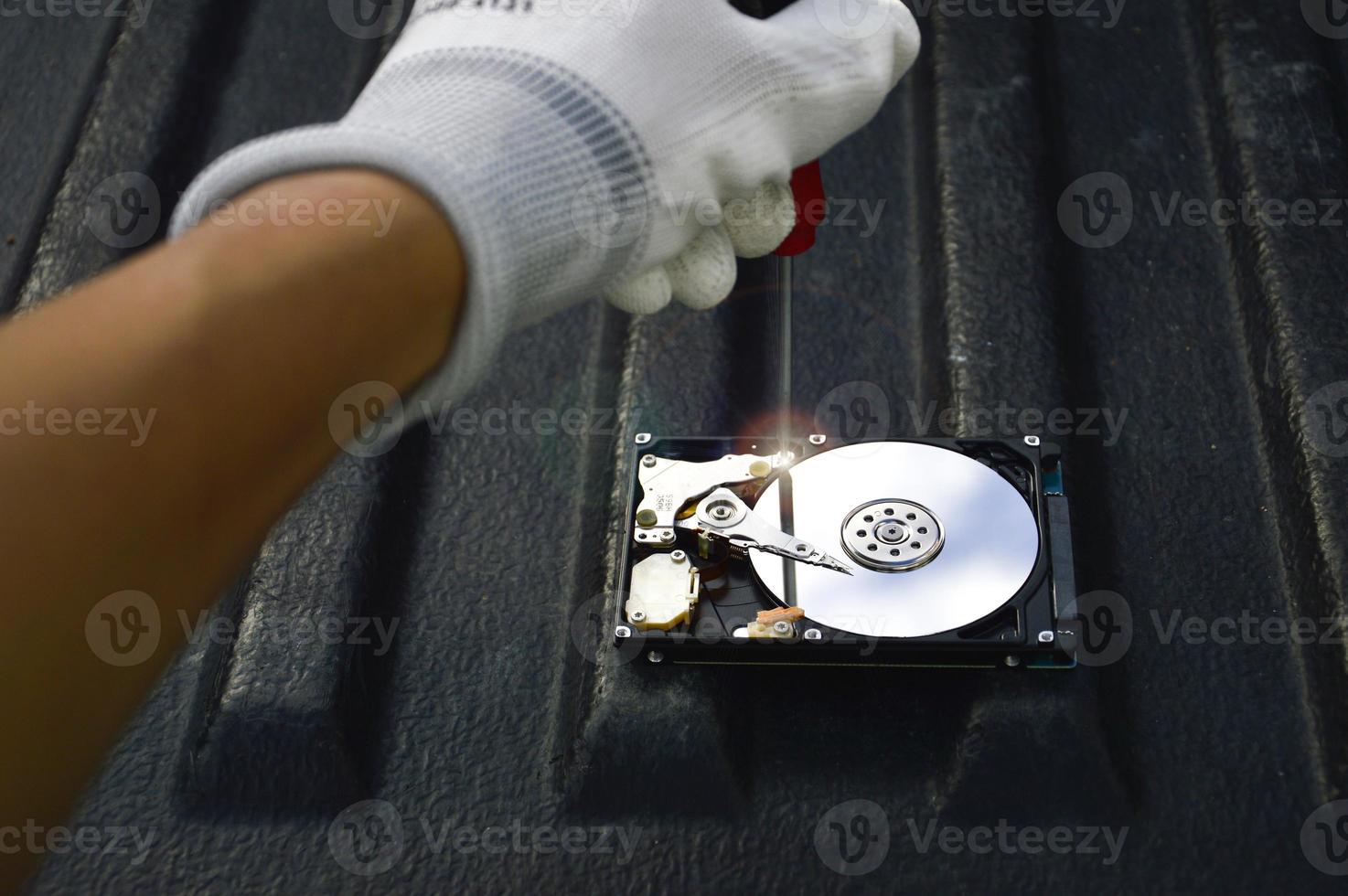 top view technician repairing hard disk photo
