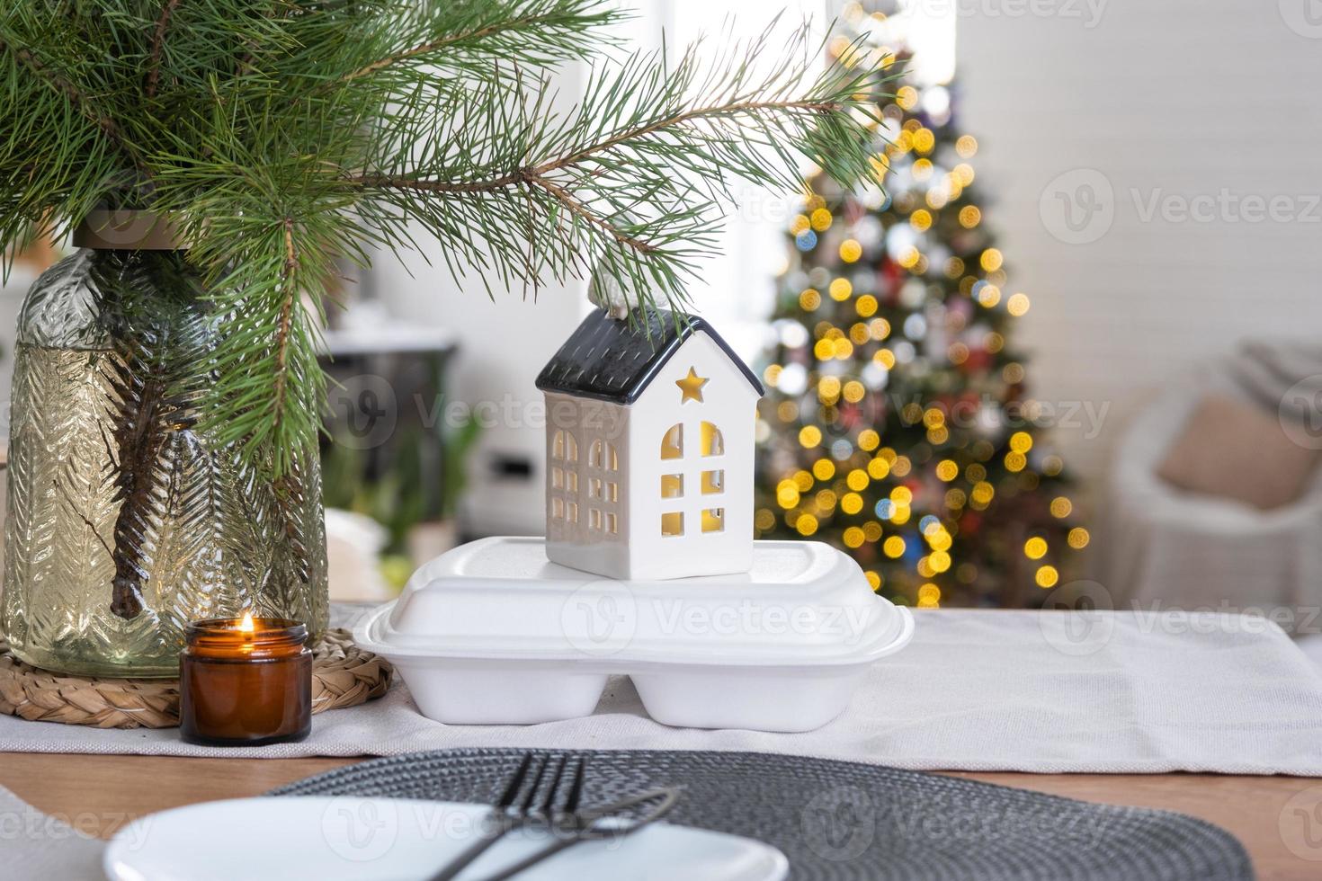 Food delivery service containers on table in white kitchen, festively served for celebration of Christmas and new year.  Saving time, hot order, disposable plastic box, craft package. mock up photo