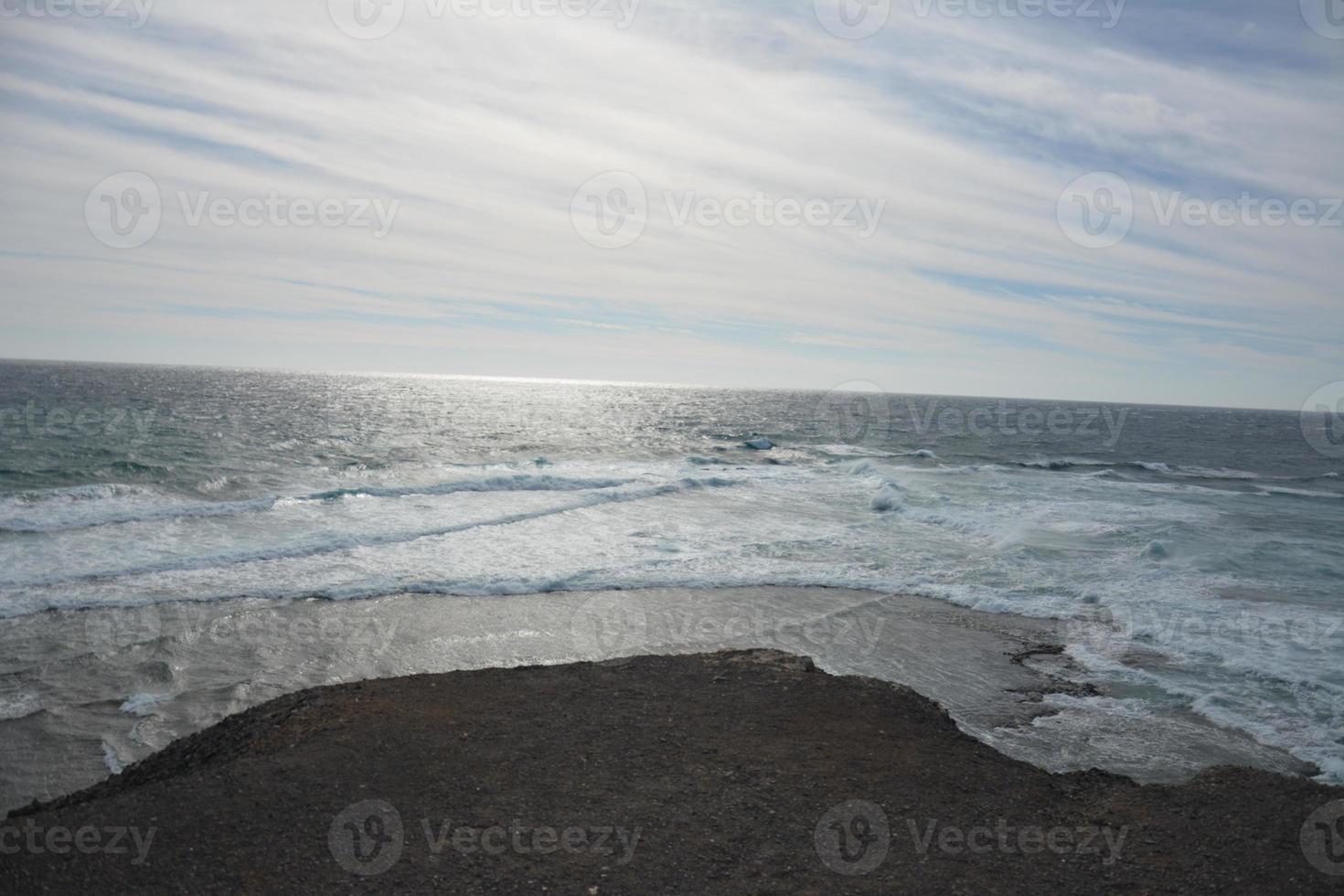 Vulcanic geologic coroded layers, Faro de Punta Jandia, Fuerteventura, Canary Islands, Spain. photo