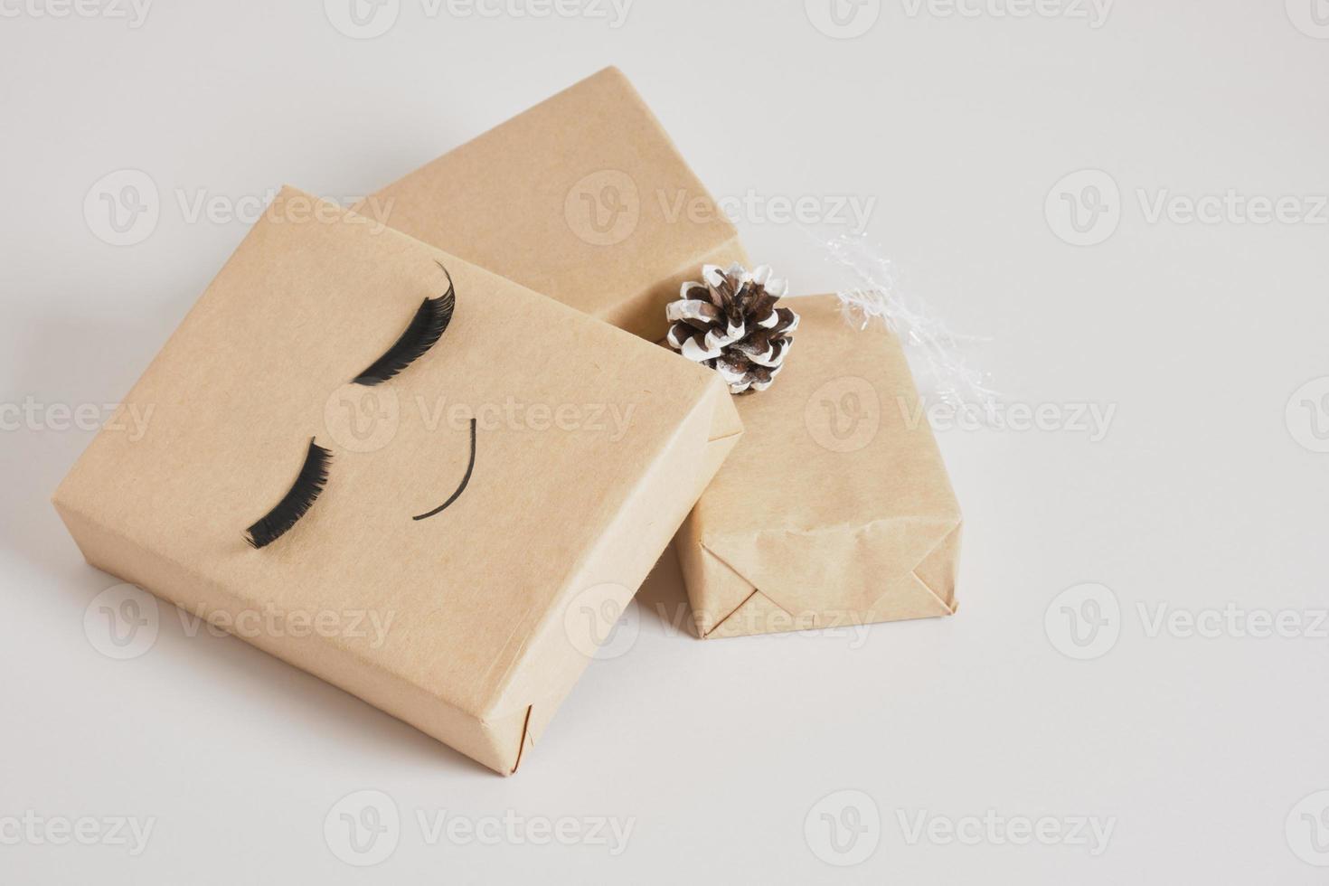 gift boxes with kraft paper on gray background photo