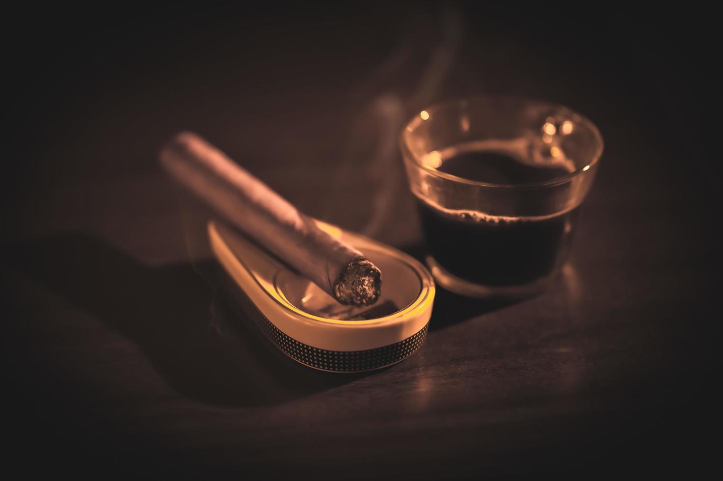A nice cigar and espresso on a winters eve for a calming evening photo