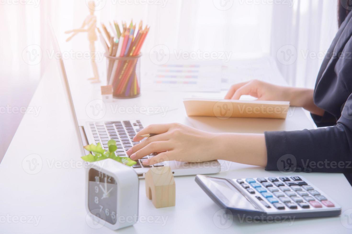 A young business woman using laptop computer. photo