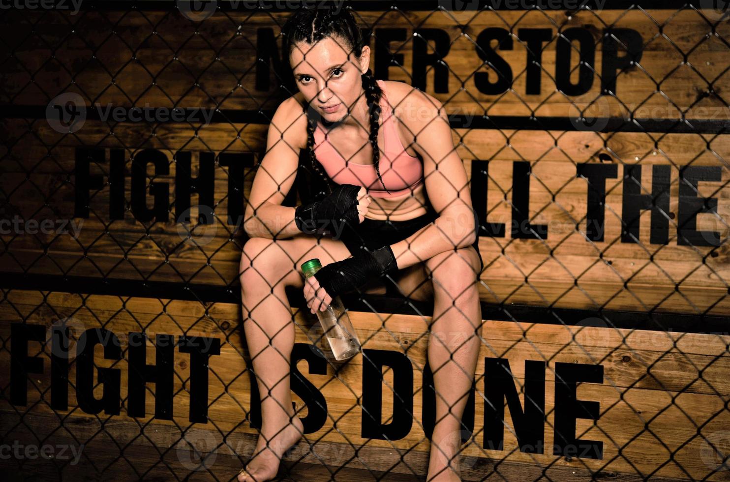 female fighter resting after the training photo