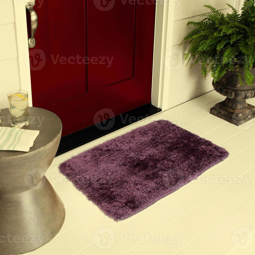 Designer Welcome Entry Doormat Placed on Floor Outside Entry Door with Plants and lemon ice drink photo