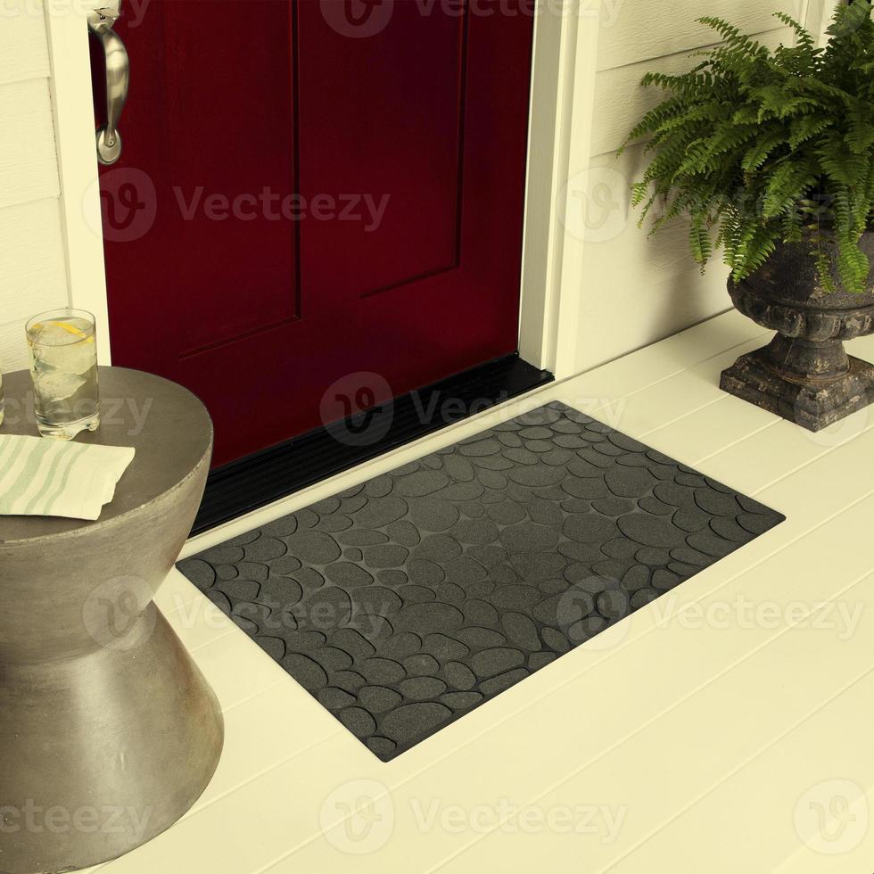 Designer Welcome Entry Doormat Placed on Floor Outside Entry Door with Plants and lemon ice drink photo