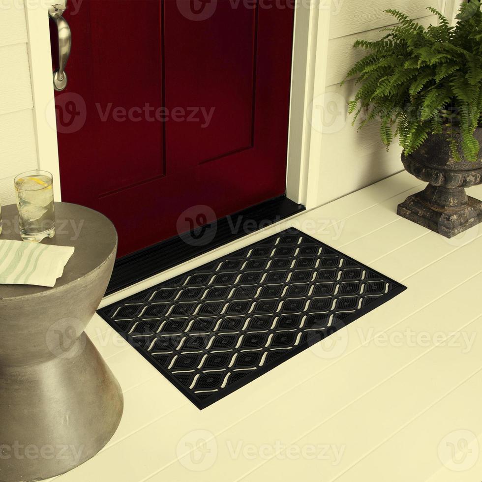 Designer Welcome Entry Doormat Placed on Floor Outside Entry Door with Plants and lemon ice drink photo