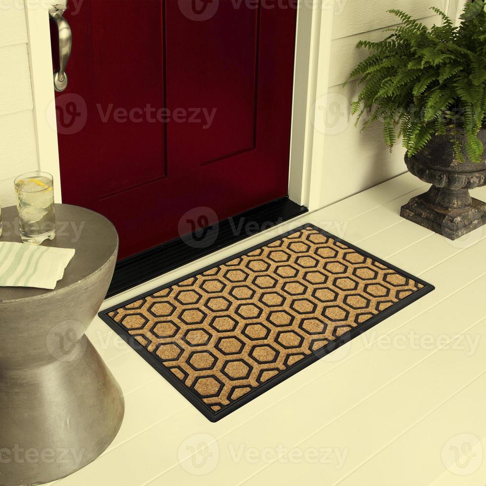 Designer Welcome Entry Doormat Placed on Floor Outside Entry Door with Plants and lemon ice drink photo