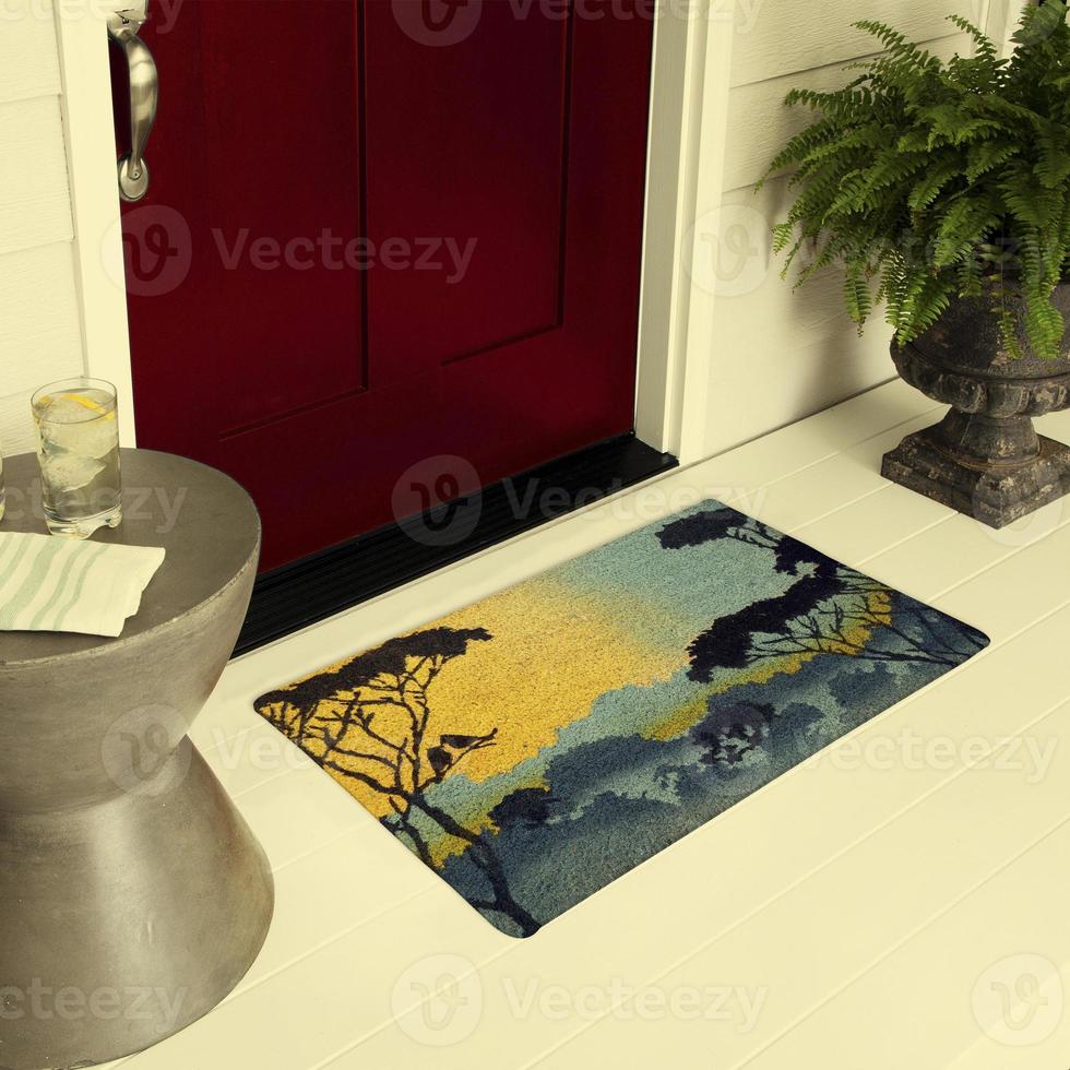 Designer Welcome Entry Doormat Placed on Floor Outside Entry Door with Plants and lemon ice drink photo