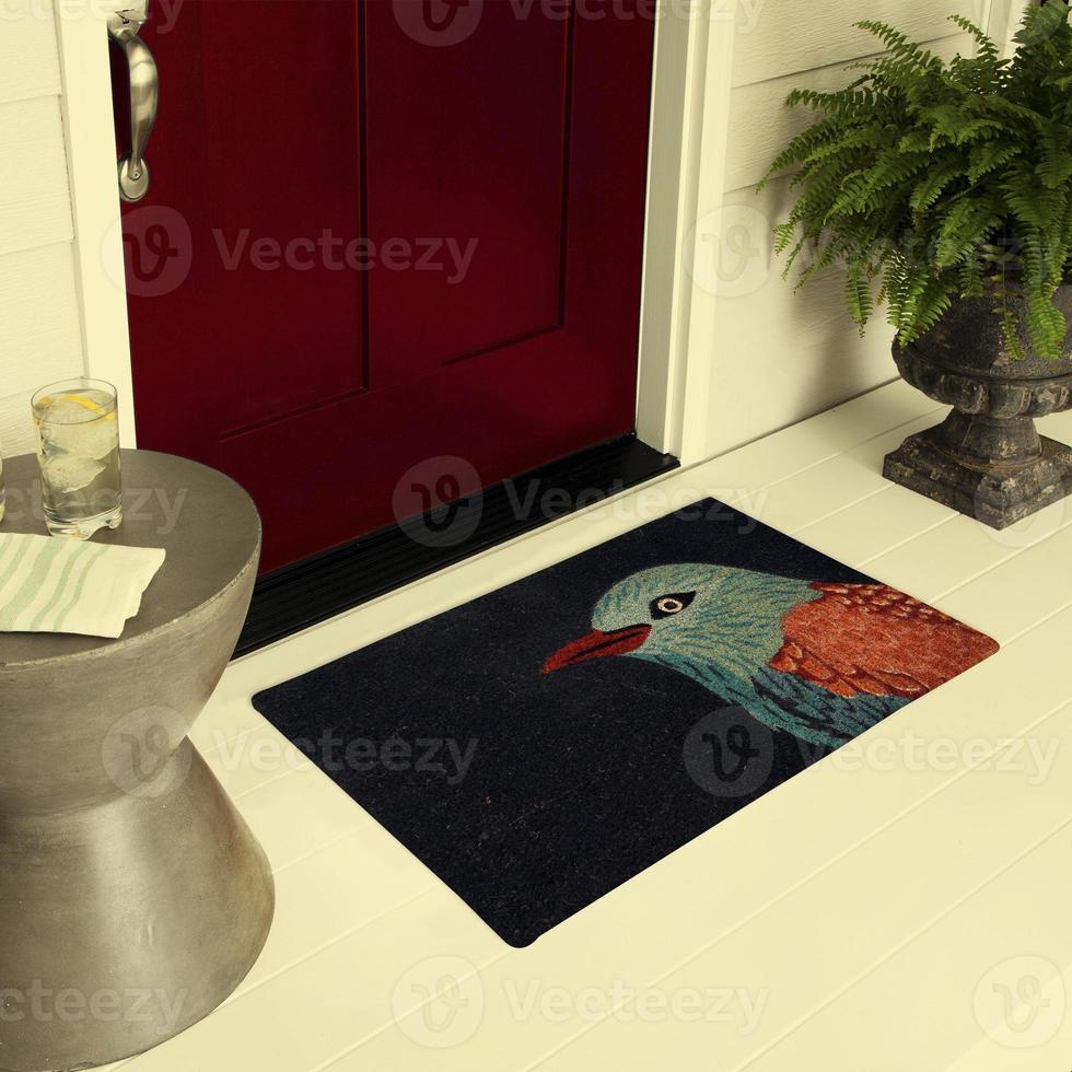 Designer Welcome Entry Doormat Placed on Floor Outside Entry Door with Plants and lemon ice drink photo