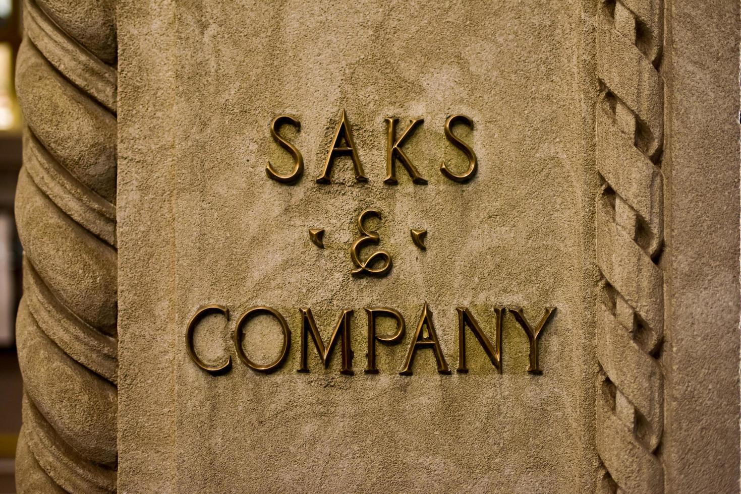 New York, New York - October 29, 2016 -  Saks and Company signage on the flagship Fifth Avenue store of high end department store Saks Fifth Avenue. The store opened in the 1920's. photo