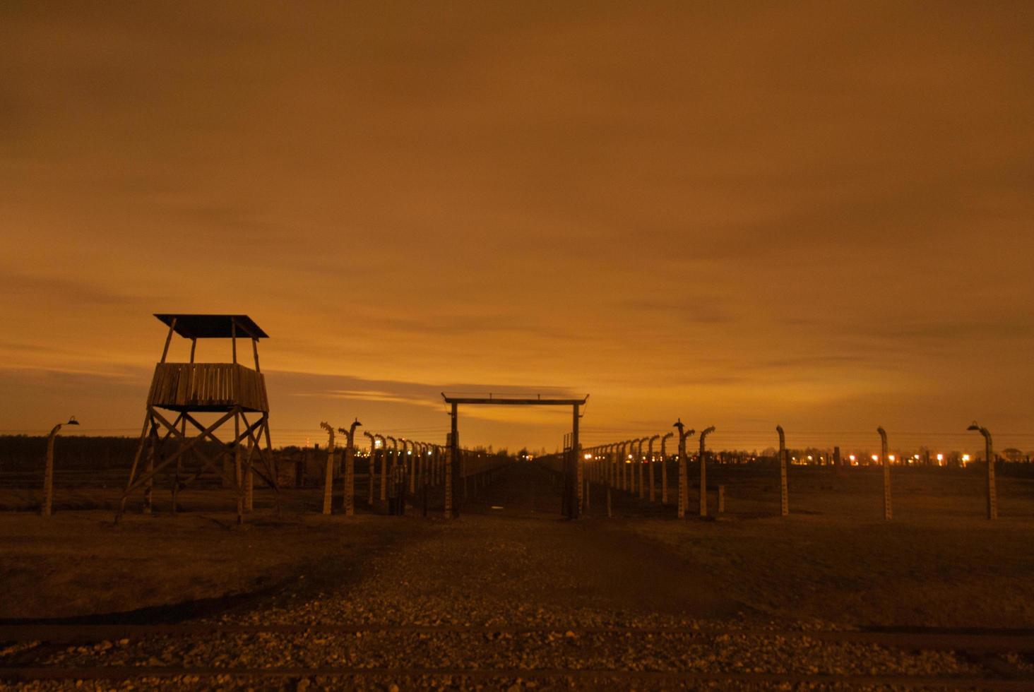 Birkinau Concentration Camp at night with guard tower, 2022 photo